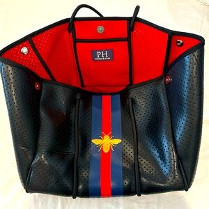 Parker and Hyde Neoprene tote with machining wallet clutch.